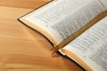 Open Bible with bookmark on wooden table, closeup Royalty Free Stock Photo