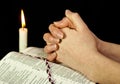 Open Bible with burning candle Royalty Free Stock Photo
