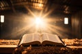 An open Bible and a cross on a wooden table in the sunlight Royalty Free Stock Photo