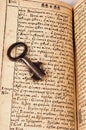 Open Bible with key Royalty Free Stock Photo