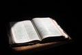 Open bible lying on a table