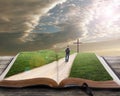 Open bible with man and cross Royalty Free Stock Photo