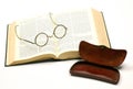 Open bible with a pair of glasses