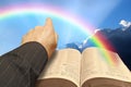 open bible rainbow blue sky clouds arm hand pointing god jesus christ heaven kingdom