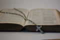Open Bible with Rosary and Crucifix Royalty Free Stock Photo