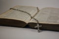 Open Bible with Rosary and Crucifix Royalty Free Stock Photo