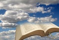 Open bible sky clouds background Royalty Free Stock Photo
