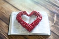 Open bible on the table. A heart. Holy Bible Royalty Free Stock Photo