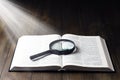 Open Bible. On the table. Holy Bible, Scripture. Magnifier Royalty Free Stock Photo