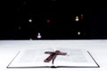 An open Bible on the table. Prayer. Wooden cross. Crucifix. Holy. On the background of the Christmas tree. Light and garlands Royalty Free Stock Photo