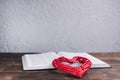 An open Bible on the table. The red heart is the love of God. Prayer Royalty Free Stock Photo