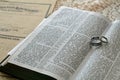 Open Bible with wedding rings Royalty Free Stock Photo
