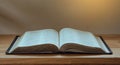 Open Bible on a wood table with light from window Royalty Free Stock Photo