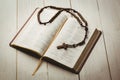 Open bible and wooden rosary beads Royalty Free Stock Photo