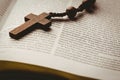 Open bible and wooden rosary beads Royalty Free Stock Photo