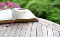 Open bible on wooden table. Soft focus, blur text Royalty Free Stock Photo