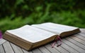 Open bible on wooden table. Soft focus, blur text Royalty Free Stock Photo