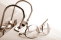 Open binder and glasses over document Royalty Free Stock Photo