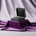 Open Black Box on Purple Fabric Royalty Free Stock Photo