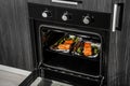 Open black built-in convection oven in the kitchen.