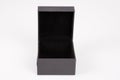 Open black carton paper gift jewelry box isolated on white background