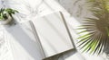 Open Blank Book on Marble with Tropical Plant Shadows