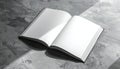 Open Blank Book on Textured Surface with Dramatic Light Royalty Free Stock Photo