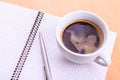Open blank note book with coffee cup on table Royalty Free Stock Photo