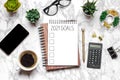 Open blank note book, glasses, cup of coffee, pen, smartphone, succulents on marble table Royalty Free Stock Photo