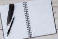 Open blank notebook,pen and feather Royalty Free Stock Photo