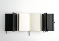 Open blank notebooks arranged symmetrically on white background Royalty Free Stock Photo