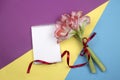 Open blank notepad and bouquet of pink flowers on table top view in flat lay style Royalty Free Stock Photo