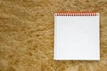 Open blank notepad on organic yellow straw textured backgrounds. Royalty Free Stock Photo
