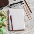 Open a blank Notepad, pen, glasses, phone, handbag and scarf Royalty Free Stock Photo