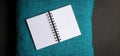 Open blank notepad on top of blue color pillow case Royalty Free Stock Photo