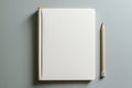 Open blank white bound notebook on a clean workspace with a pencil for writing down ideas Royalty Free Stock Photo