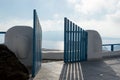 Open blue door overlooking the Mediterranean sea Royalty Free Stock Photo