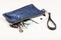 Handbag with phone, keys and euro notes on table Royalty Free Stock Photo