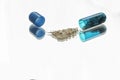 Open blue pill closeup with the medicine out Royalty Free Stock Photo