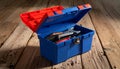 Open Blue and Red Toolbox Filled with Wrenches and Screwdrivers on Wood tools Royalty Free Stock Photo