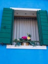 Open Blue window shutters in Burano Italy Royalty Free Stock Photo