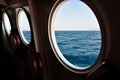 Open boat porthole with ocean view