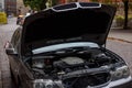 Open bonnet of broken BMW car Royalty Free Stock Photo