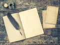 Open book, antique writing tools feather pen and inkwell. Vintage style Royalty Free Stock Photo
