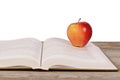 Open book with apple isolated on white background Royalty Free Stock Photo