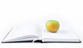 Open book and apple. On a white background. Science and knowledge wisdom concept