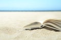 Open book on the beach