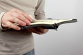 Open book the bible in the hands of men Royalty Free Stock Photo