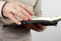 Open book the bible in the hands of men Royalty Free Stock Photo