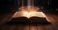 Open book Bible on wooden desk with mystic bright light. Royalty Free Stock Photo